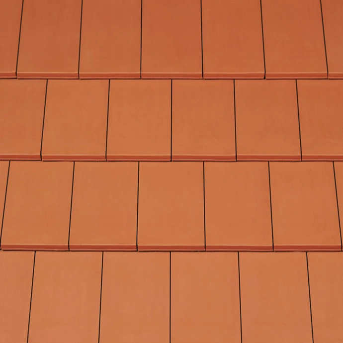 CREATON Domino Glattziegel in Rot engobiert – moderner Tondachziegel für zeitgenössische Architektur